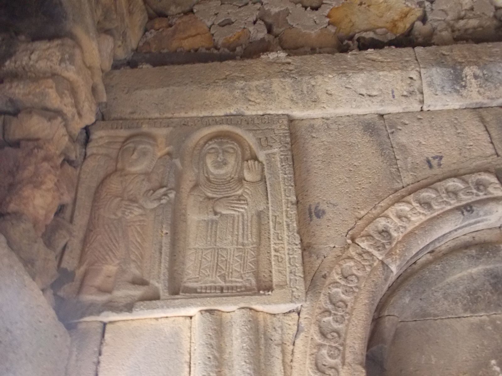 Bas-relief of what is thought to be national saints in the cloister of Bgheno-Noravank.