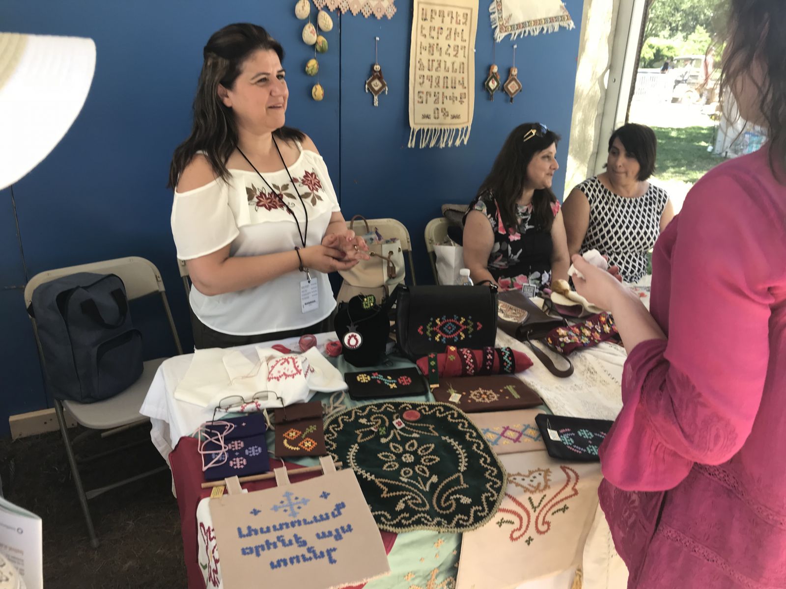 Syrian Armenian needleworker, Ayda Santouian Degirmenjian, displays her craftwork at the Smithsonian Folklife Festival.