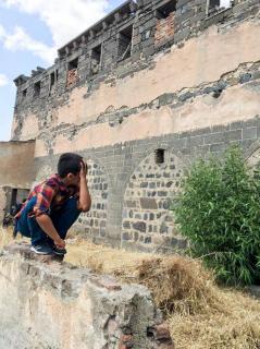 Our youngest adventurer, Veysel, (a hidden Armenian) shows us the ruins of St. Sarkis Church in Diyarbakir, which was caught in the crosshairs of violence three years ago between local Kurds and the Turkish military.