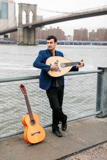 The writer, performer, and musical mastermind behind “Critical Distance”: Raffi Joe Wartanian, with an oud in his arms and guitar by his side.(Photo: Anastasia Italyanskaya)