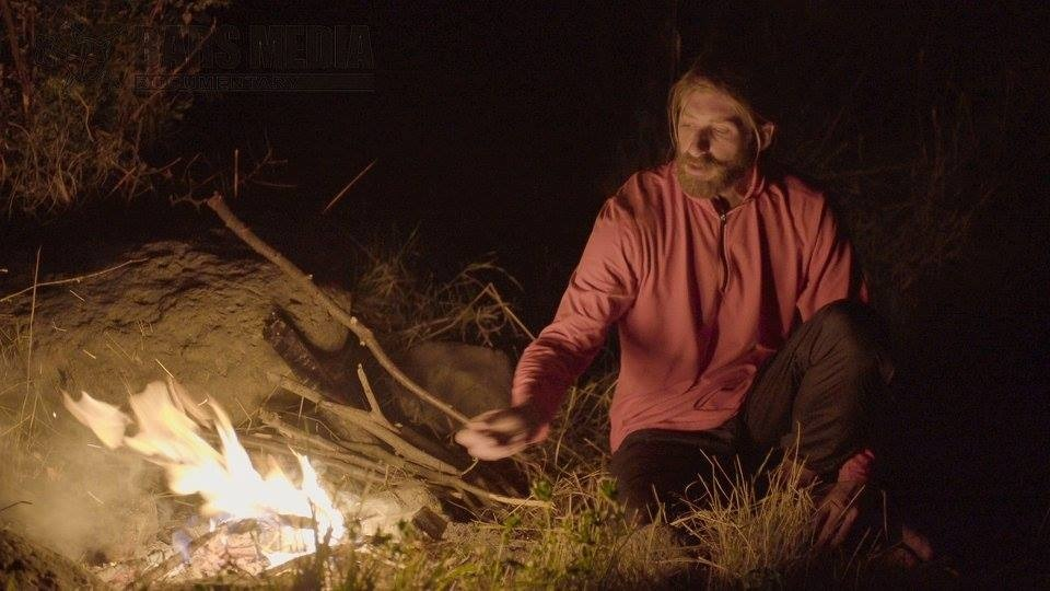 Adventurer Roffi Petrosian builds a campfire in Armenia’s wilderness. (Screenshot: Bars Media)