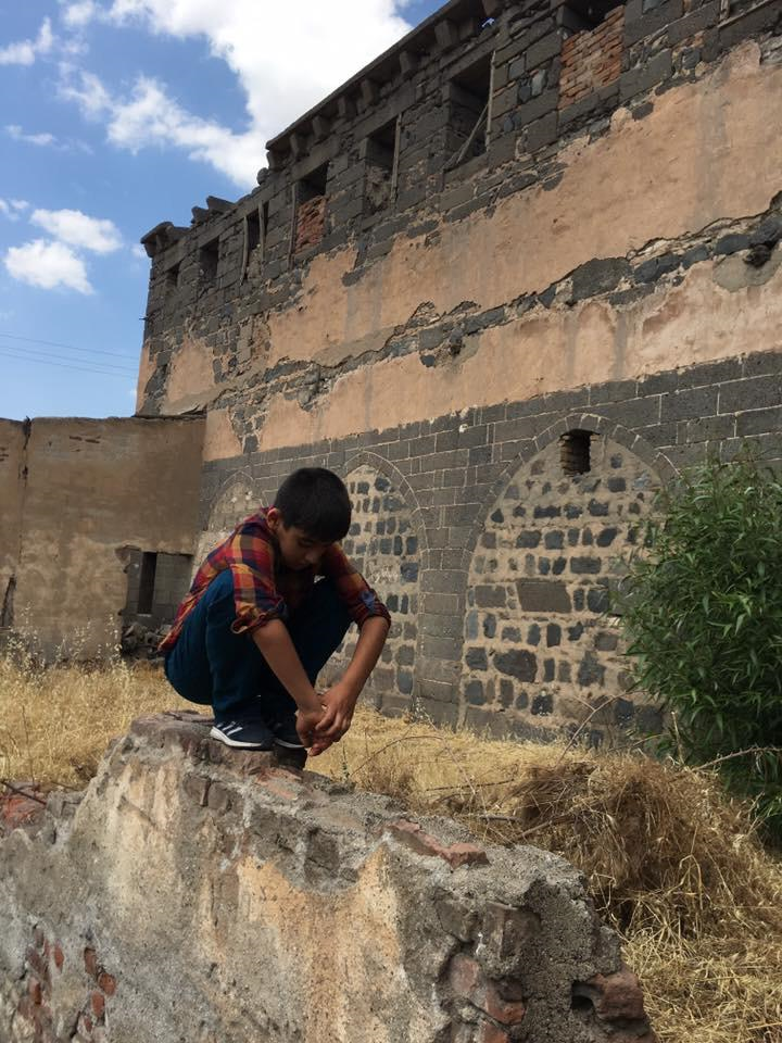 Our youngest adventurer, Veysel, (a hidden Armenian) shows us the ruins of St. Sarkis Church in Diyarbakir, which was caught in the crosshairs of violence three years ago between local Kurds and the Turkish military.