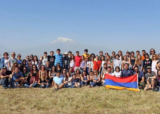 A group of Birthright Armenia volunteers pose in front of Mount Ararat.